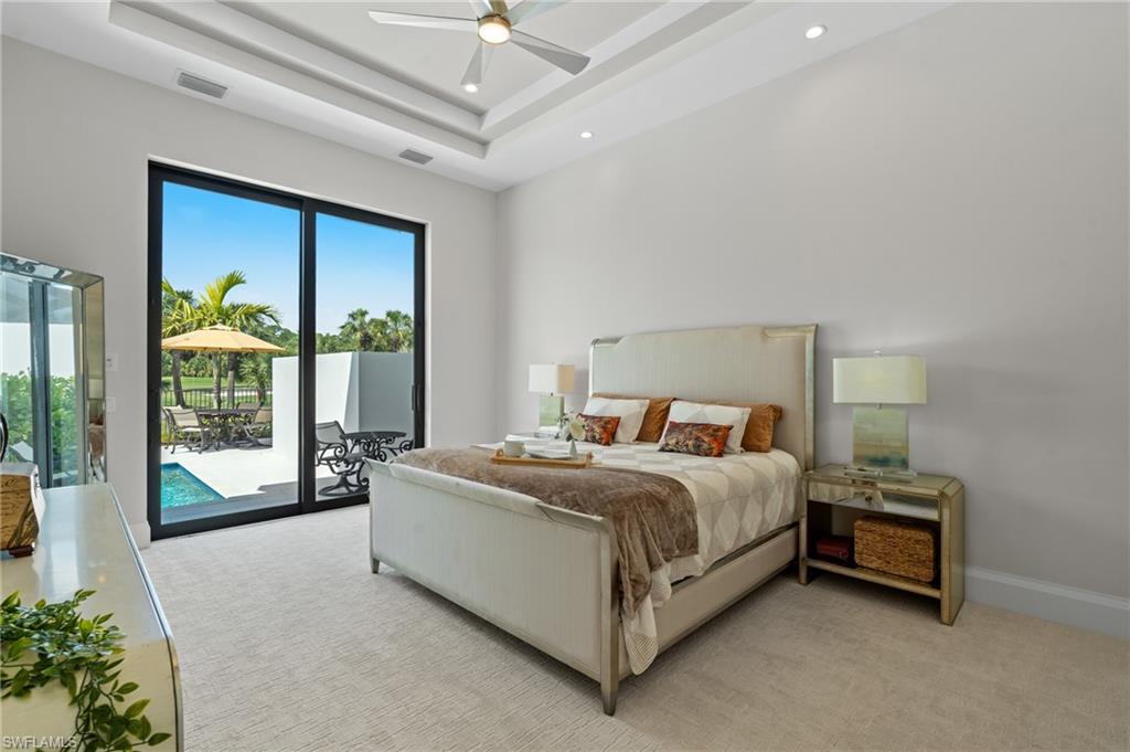 19086 Via Messina Way Miromar Lakes, FL 33913 - Photo 15 of 50 a bed room with a bed and a large window