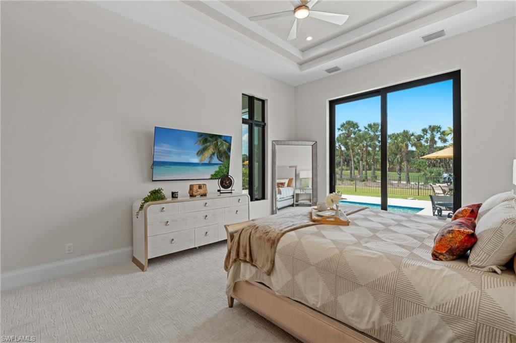 19086 Via Messina Way Miromar Lakes, FL 33913 - Photo 16 of 50 a bedroom with a bed and a large window