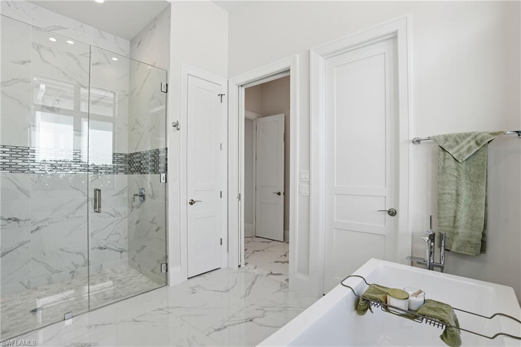 19086 Via Messina Way Miromar Lakes, FL 33913 - Photo 19 of 50 a bathroom with a shower and a sink