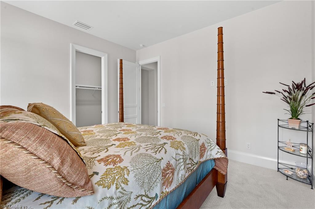 19086 Via Messina Way Miromar Lakes, FL 33913 - Photo 19 of 46 a bedroom with a bed and with potted plant