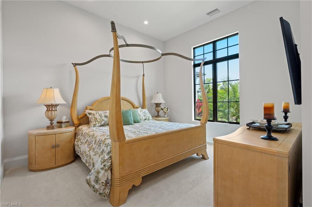 19086 Via Messina Way Miromar Lakes, FL 33913 - Photo 20 of 50 a bed room with furniture and a window