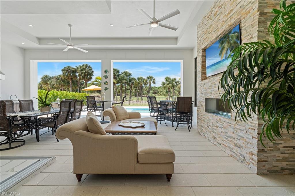 19086 Via Messina Way Miromar Lakes, FL 33913 - Photo 26 of 46 a living room with furniture and a large window