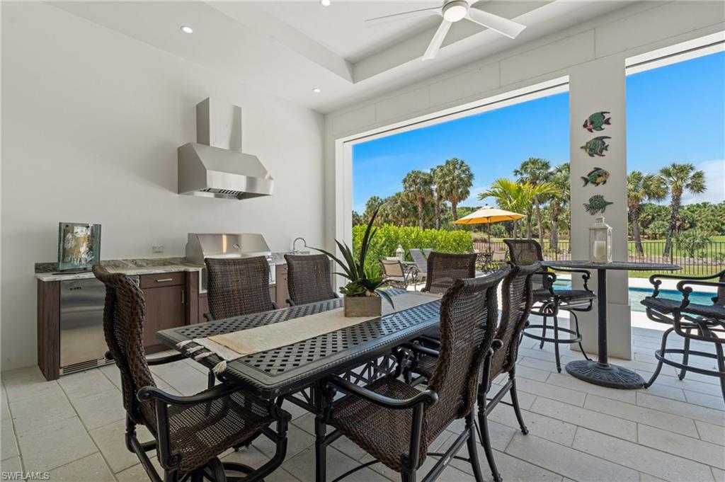 19086 Via Messina Way Miromar Lakes, FL 33913 - Photo 27 of 46 a view of a dining room with furniture and a potted plant