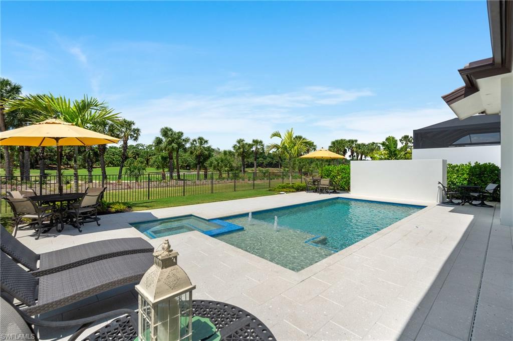 19086 Via Messina Way Miromar Lakes, FL 33913 - Photo 29 of 46 a view of a backyard with sitting area