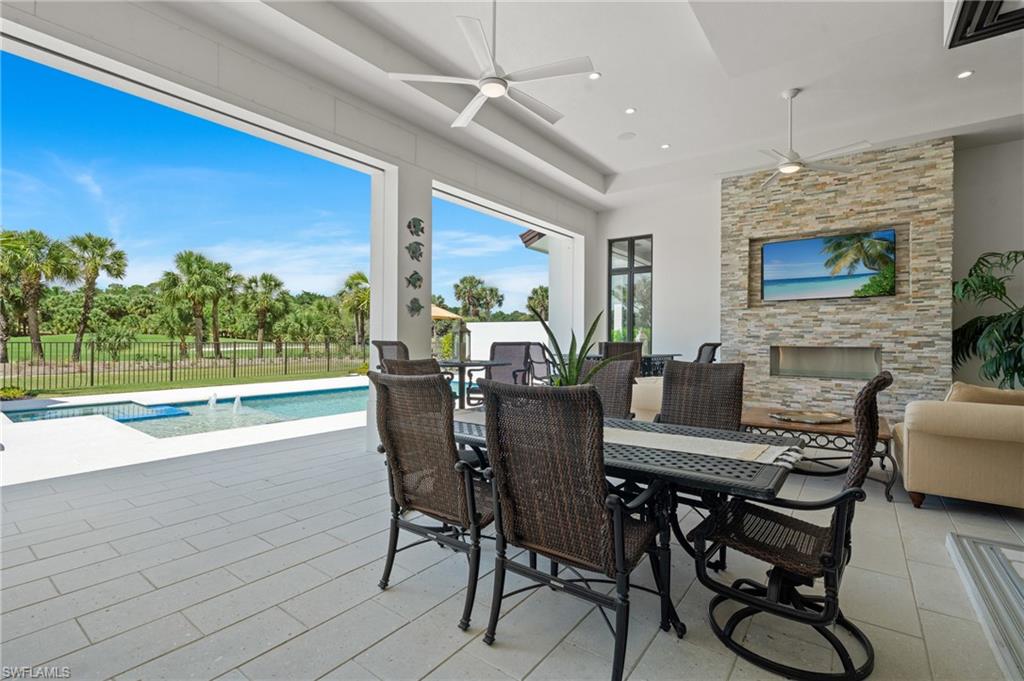 19086 Via Messina Way Miromar Lakes, FL 33913 - Photo 32 of 50 a view of a dining room with furniture window and wooden floor