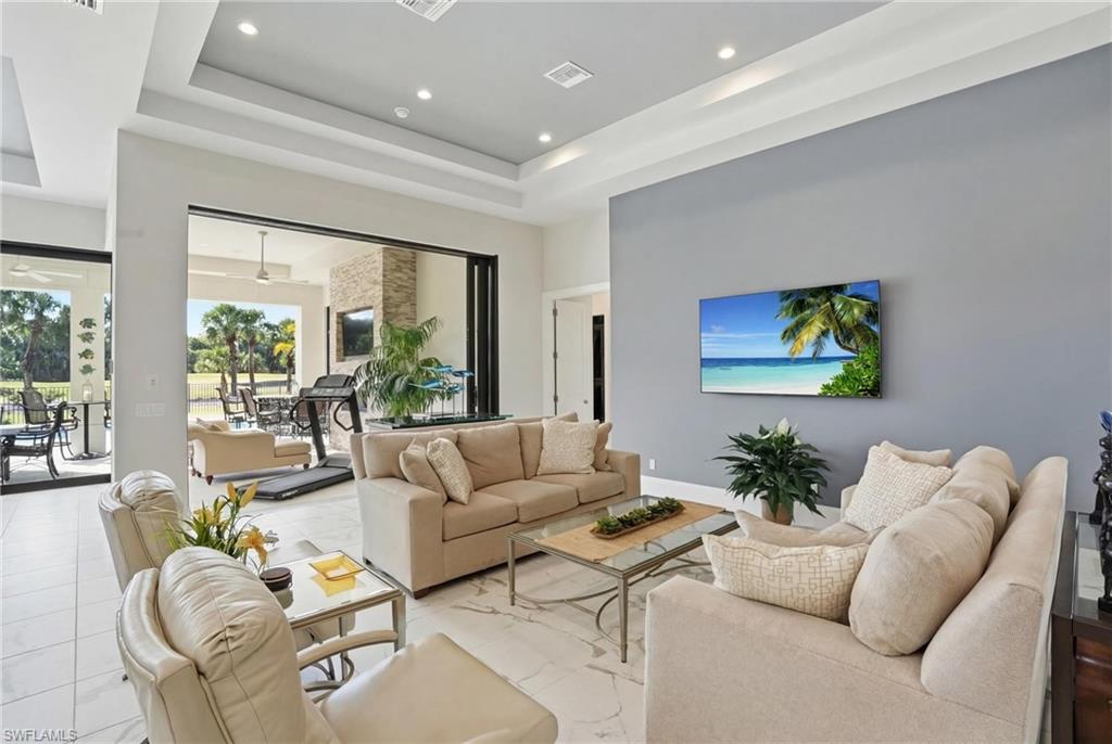 19086 Via Messina Way Miromar Lakes, FL 33913 - Photo 6 of 50 a living room with furniture and a large window