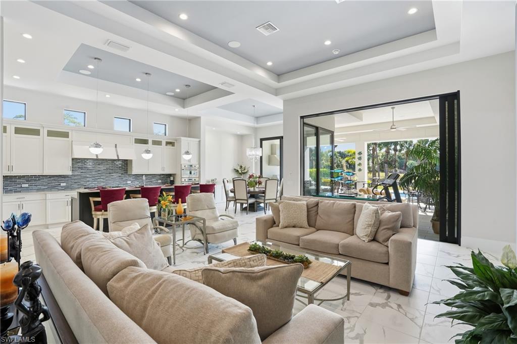 19086 Via Messina Way Miromar Lakes, FL 33913 - Photo 8 of 50 a living room with furniture and a large window