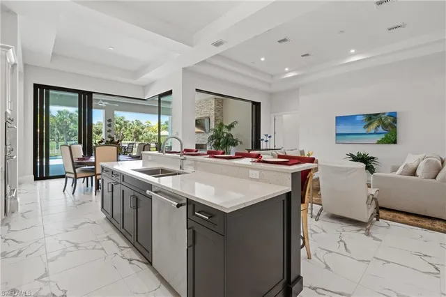a room with kitchen island a large window in it