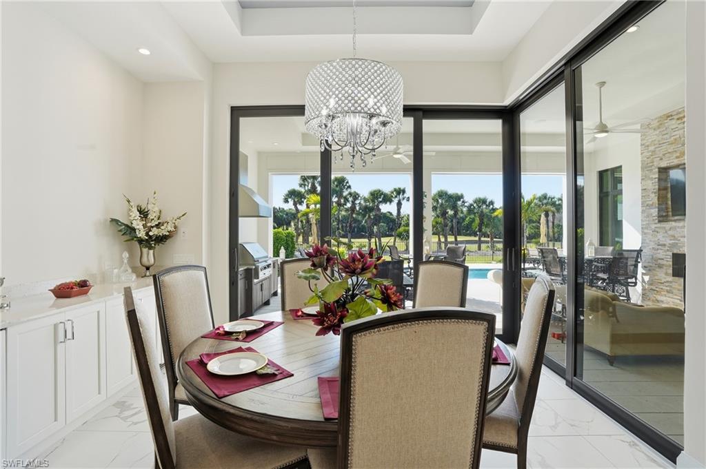 19086 Via Messina Way Miromar Lakes, FL 33913 - Photo 10 of 50 a view of a dining room with furniture window and outside view