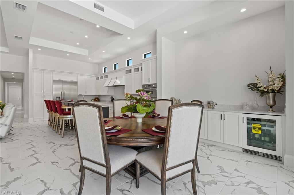 19086 Via Messina Way Miromar Lakes, FL 33913 - Photo 10 of 46 a view of a dining room with furniture