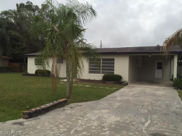 18552 Geranium Road Fort Myers, FL 33967 - Photo 1 of 20 front view of a house with a yard
