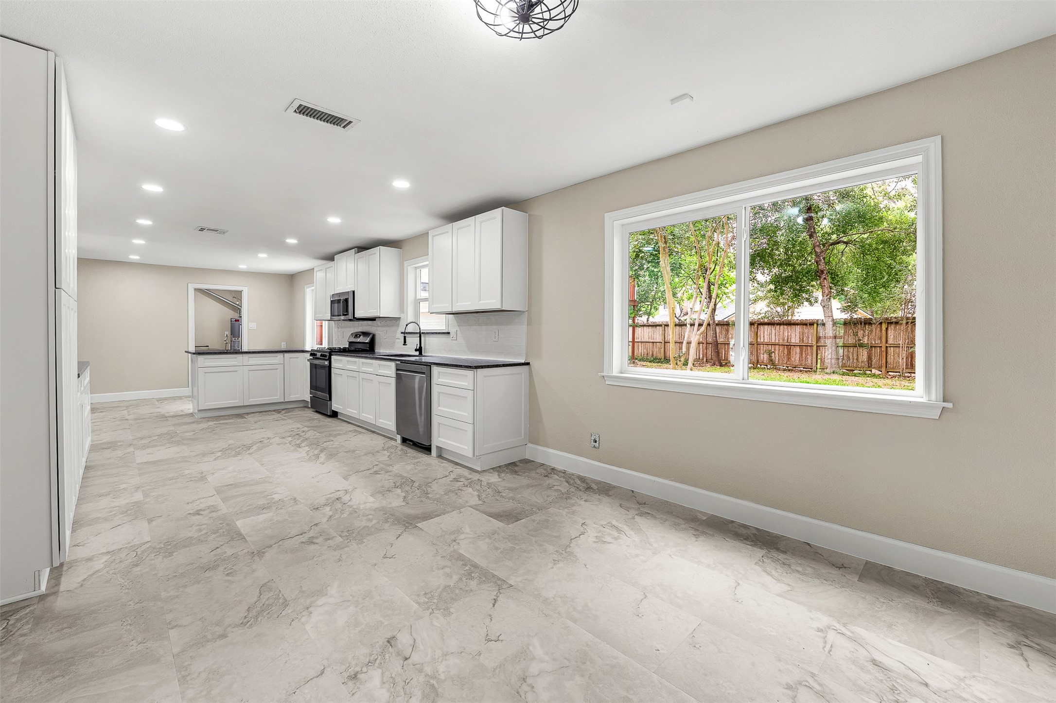 4238 Annawood Circle Spring, TX 77388 - Photo 12 of 46 a large white kitchen with stainless steel appliances granite countertop a large counter top and a refrigerator