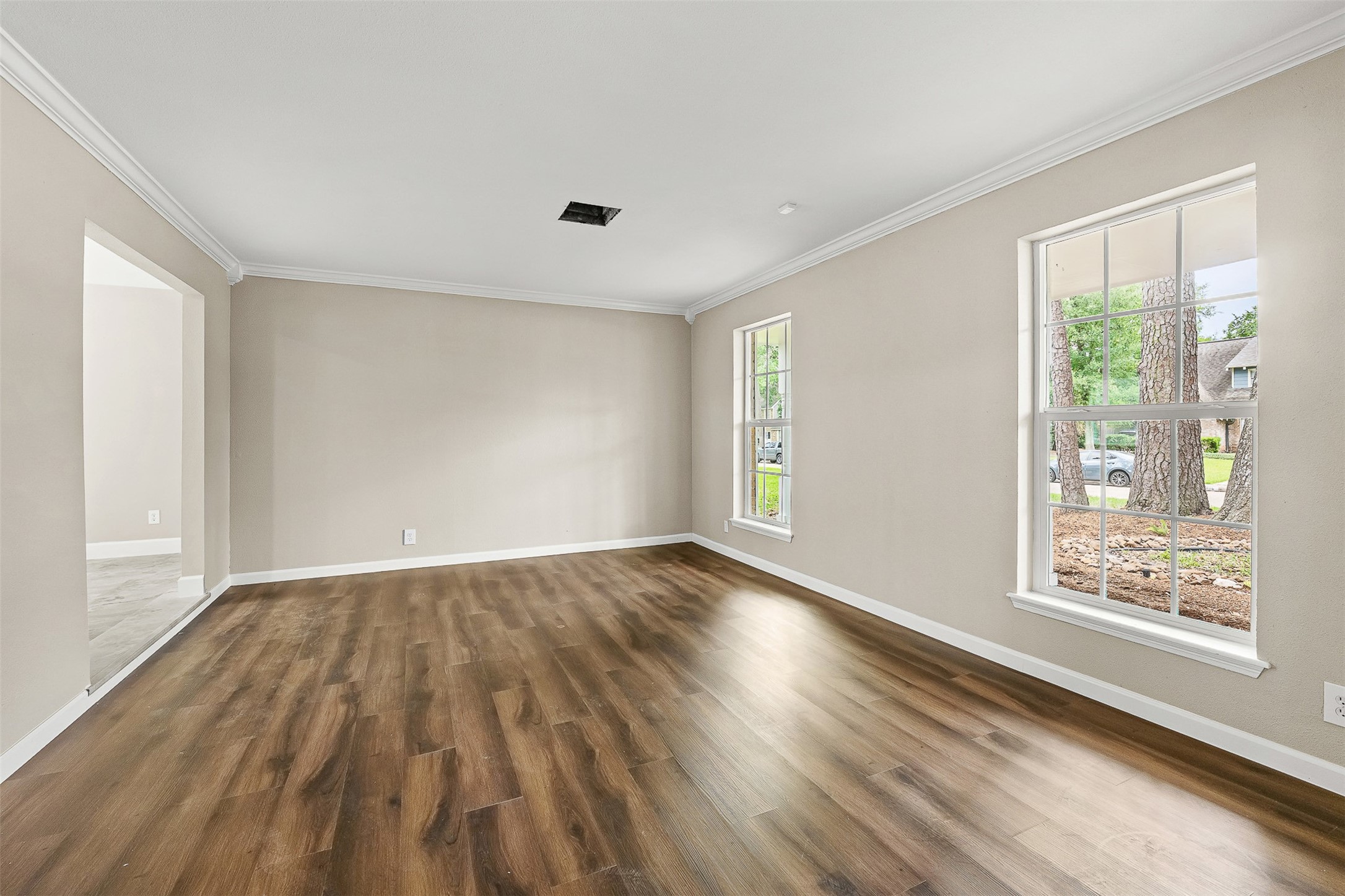 4238 Annawood Circle Spring, TX 77388 - Photo 16 of 46 an empty room with wooden floor and windows