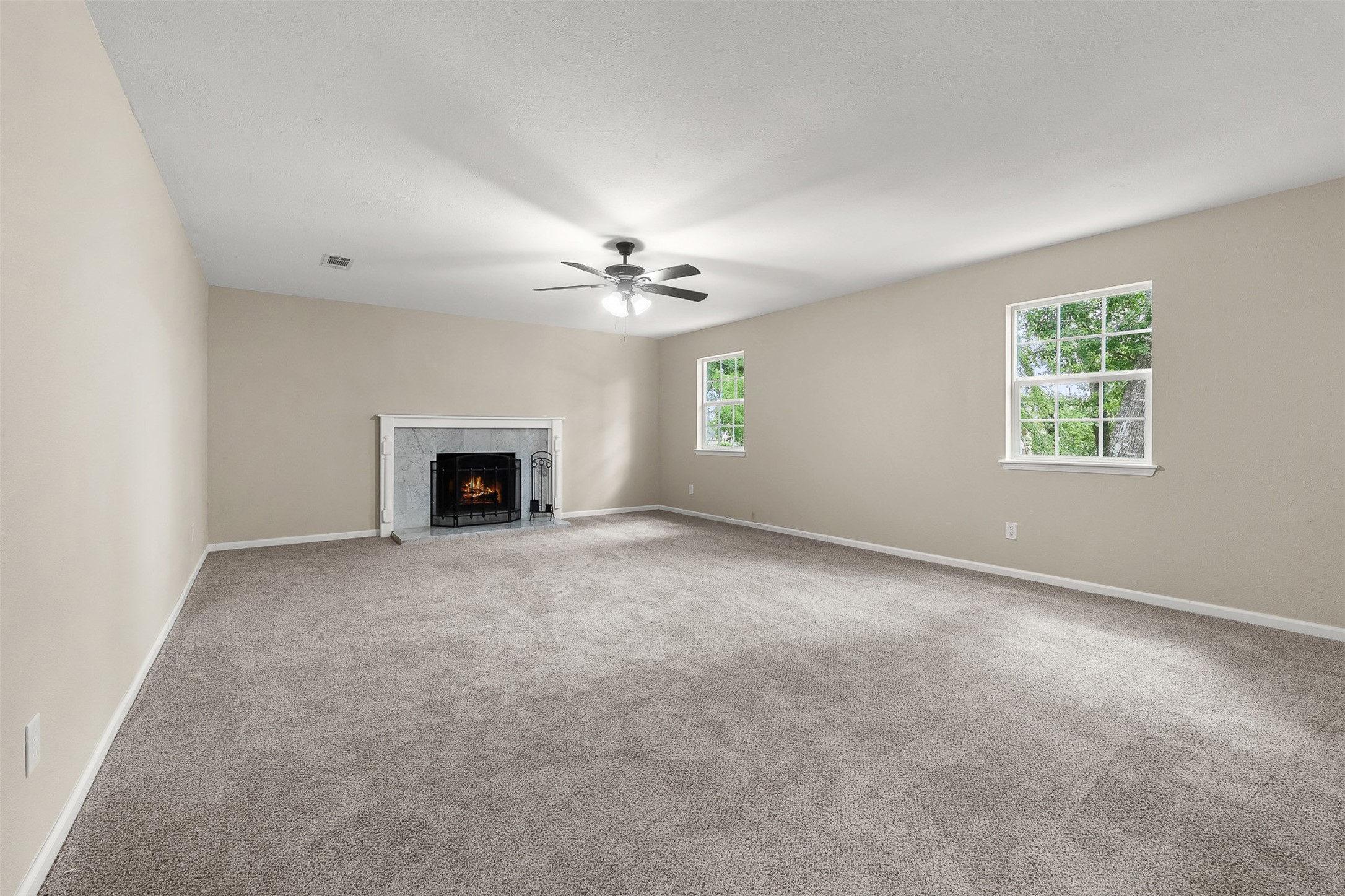 4238 Annawood Circle Spring, TX 77388 - Photo 20 of 46 an empty room with windows and fireplace