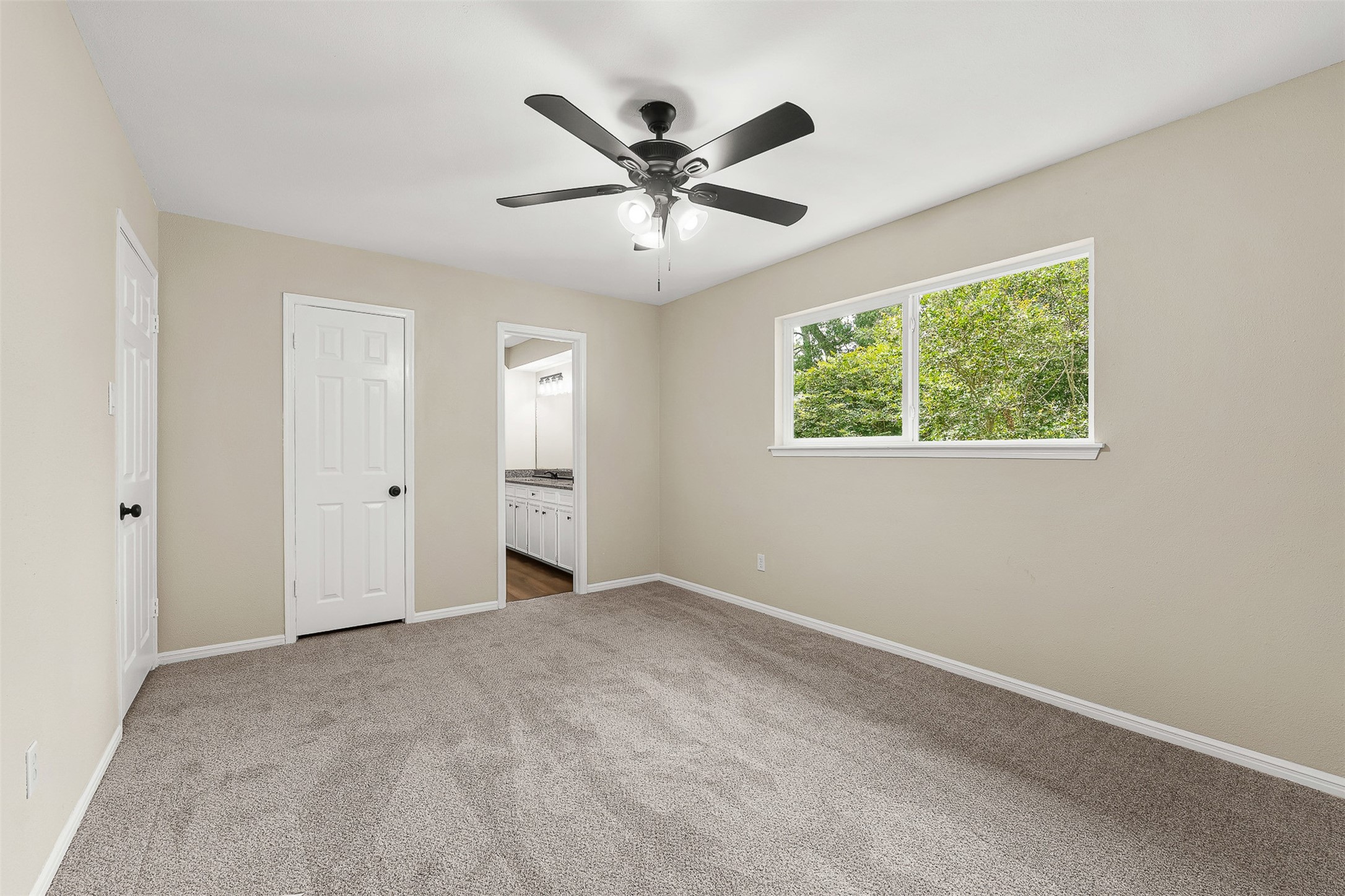 4238 Annawood Circle Spring, TX 77388 - Photo 27 of 46 a view of an empty room with a ceiling fan and a window
