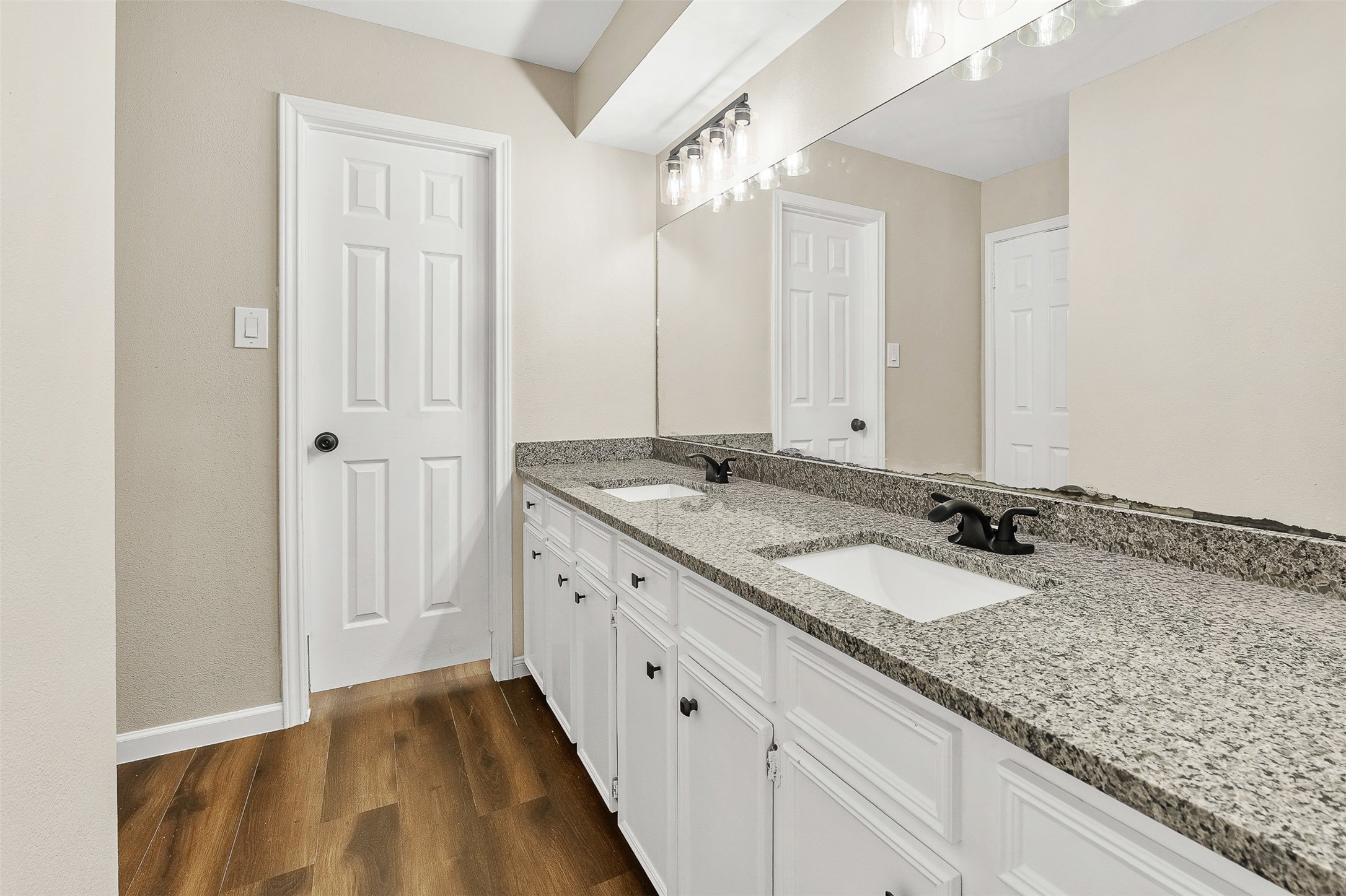 4238 Annawood Circle Spring, TX 77388 - Photo 28 of 46 a bathroom with a granite countertop sink and a mirror