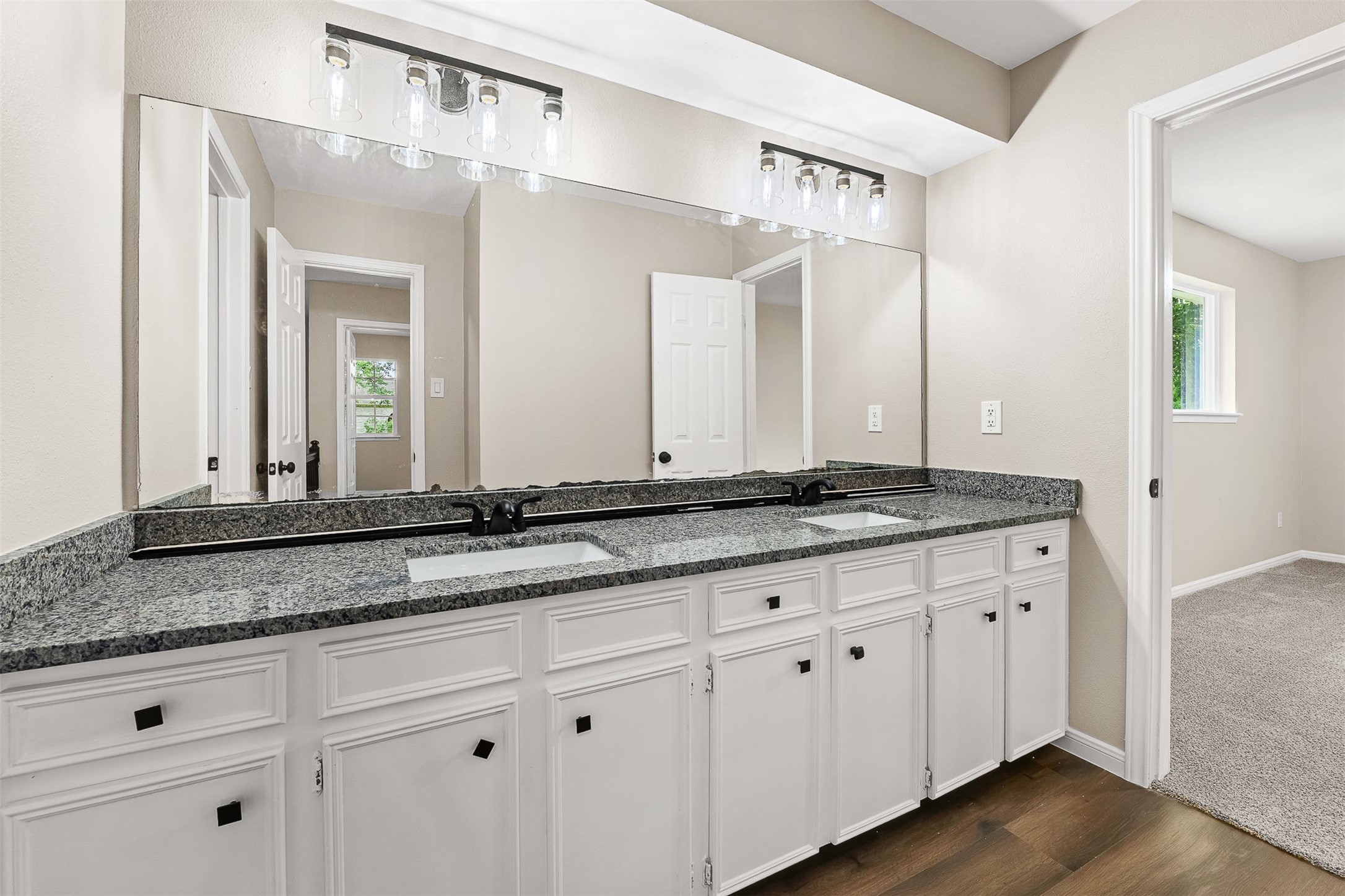 4238 Annawood Circle Spring, TX 77388 - Photo 29 of 46 a bathroom with a granite countertop sink and a mirror