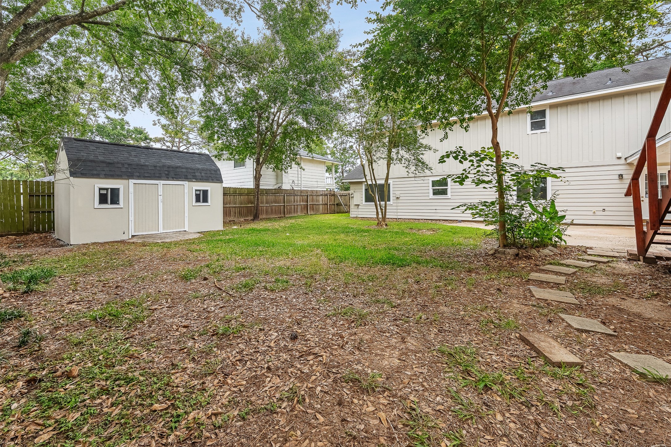 4238 Annawood Circle Spring, TX 77388 - Photo 38 of 46 a backyard of a house with plants and large tree