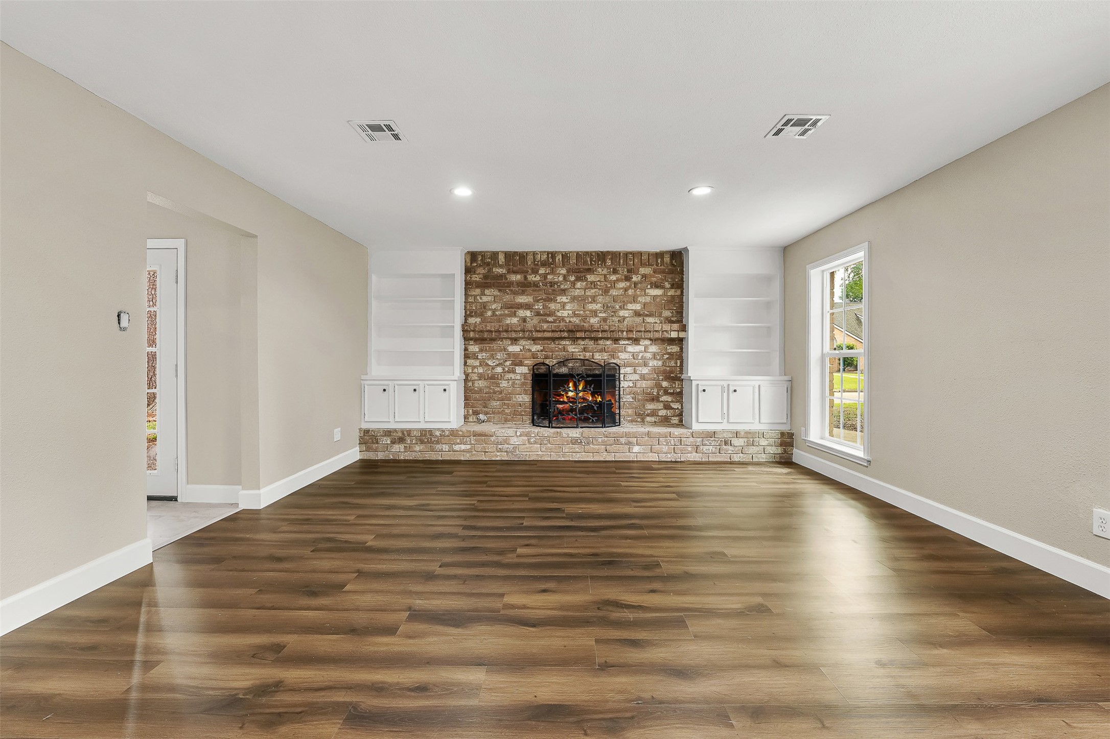 4238 Annawood Circle Spring, TX 77388 - Photo 6 of 46 a view of empty room with wooden floor and fireplace