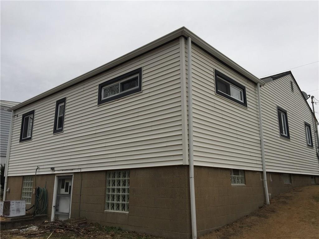 443 Bechman Street Springdale, PA 15144 - Photo 19 of 19 Rear of home with Entrance into Basement, Glass Block Windows, Nicely maintained!