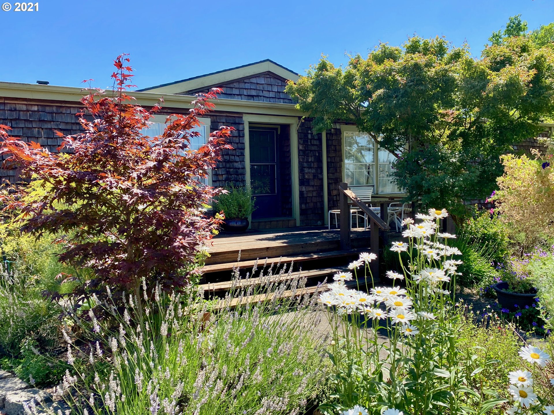 12587 South Union Hall Road Canby, OR 97013 - Photo 2 of 32 a backyard of a house with lots of green space