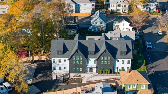 a view of multiple houses with a street