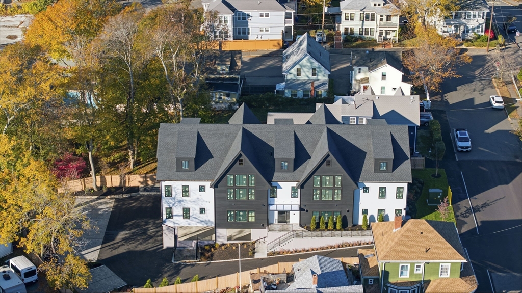 11 Boynton Street, Unit 103 Swampscott, MA 01907 - Photo 2 of 42 a view of multiple houses with a street