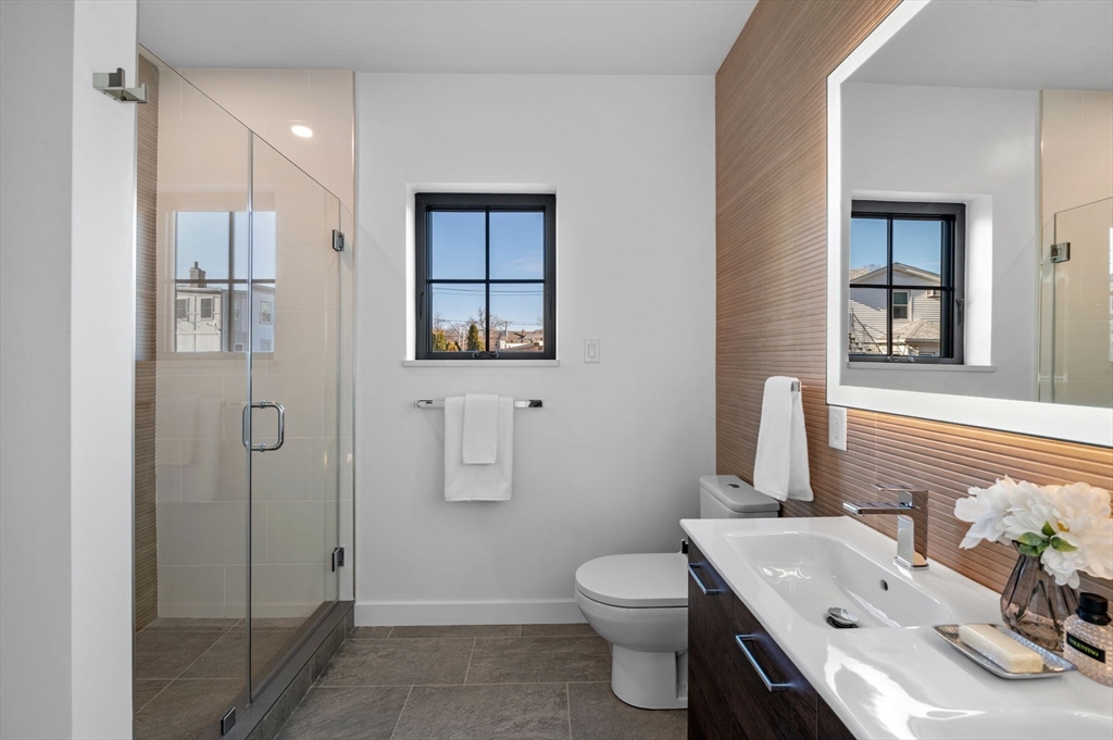 11 Boynton Street, Unit 103 Swampscott, MA 01907 - Photo 29 of 42 a bathroom with a sink toilet and shower