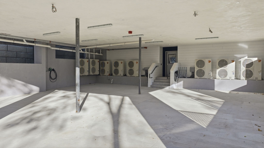 11 Boynton Street, Unit 103 Swampscott, MA 01907 - Photo 5 of 42 a view of a living room a rug and kitchen view