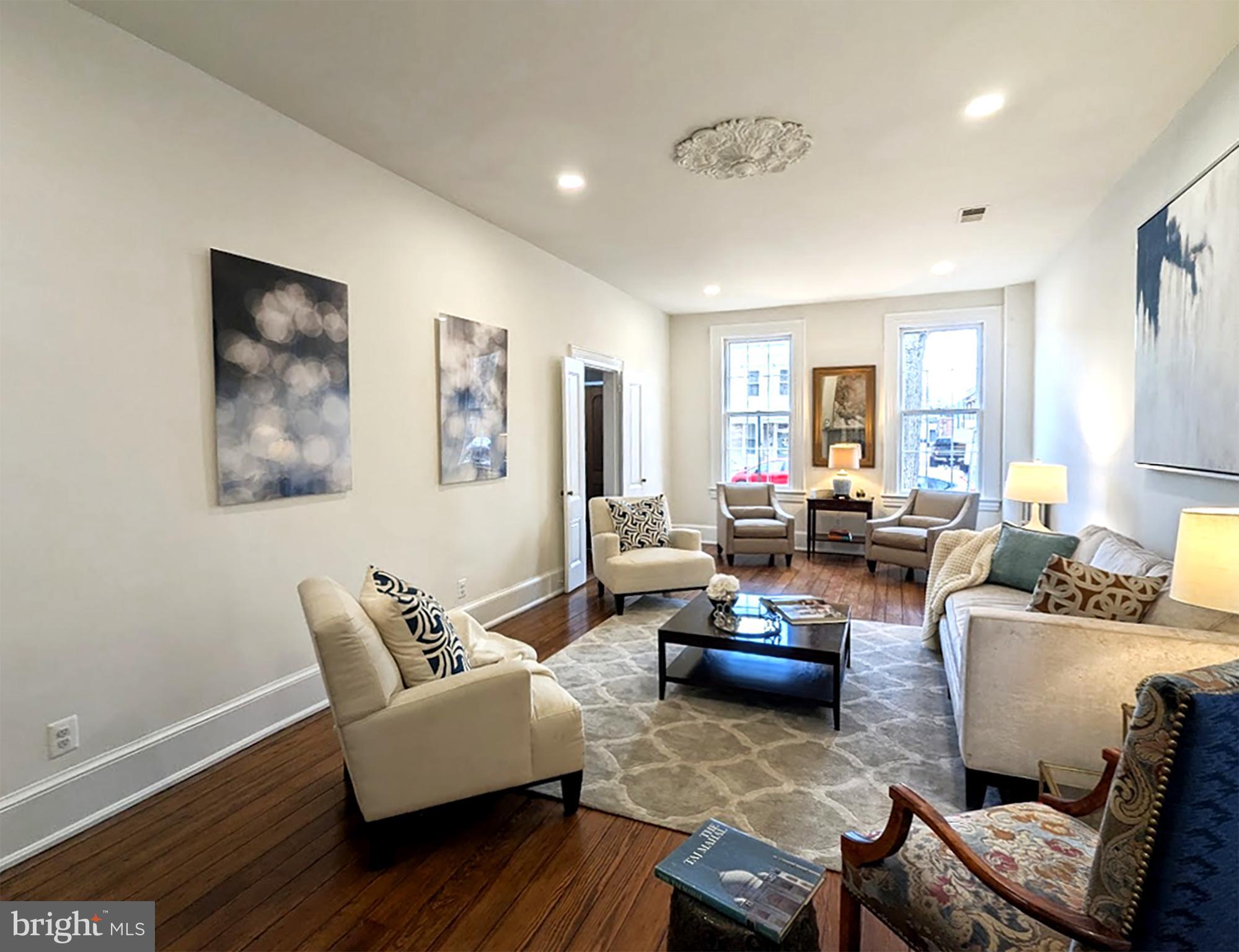 115 6th Street Southeast Washington, DC 20003 - Photo 3 of 39 Original floors, trim, fireplace. 10 ft ceilings.