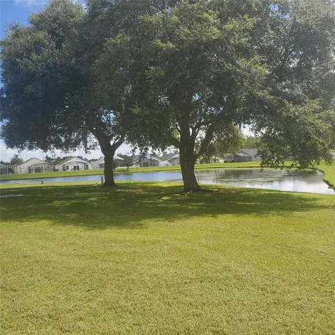 a front view of a house with a yard table and chairs