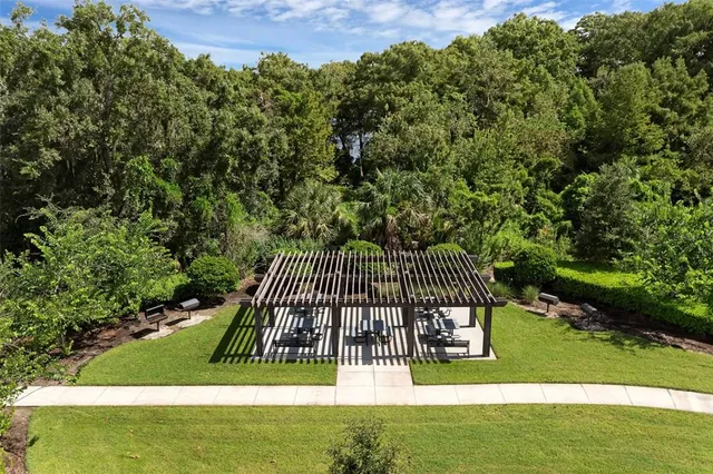 a tall building with large trees