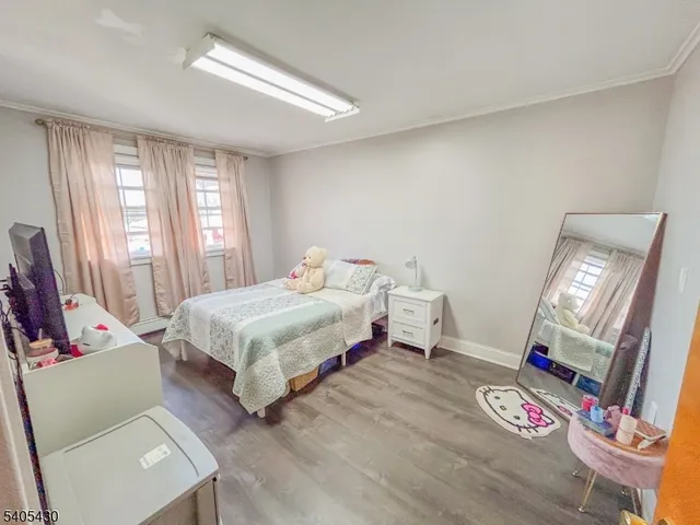 a bedroom with a bed and a mirror