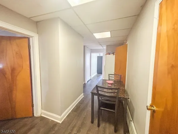 a room with furniture and wooden floor