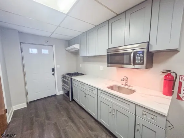 a kitchen with sink cabinets and window