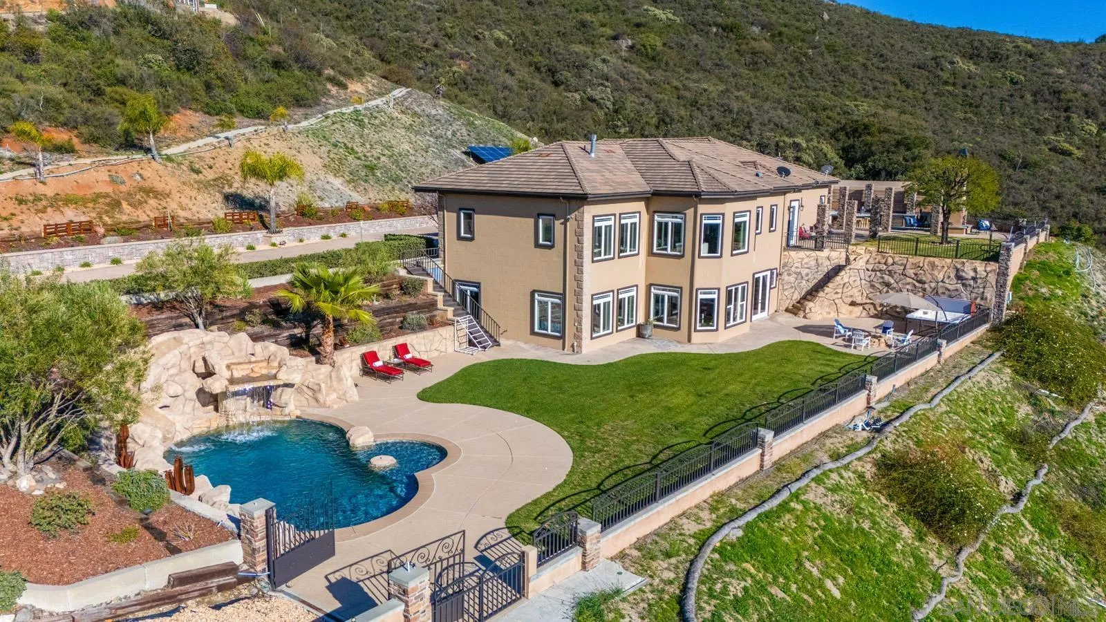 an aerial view of a house with garden space and street view