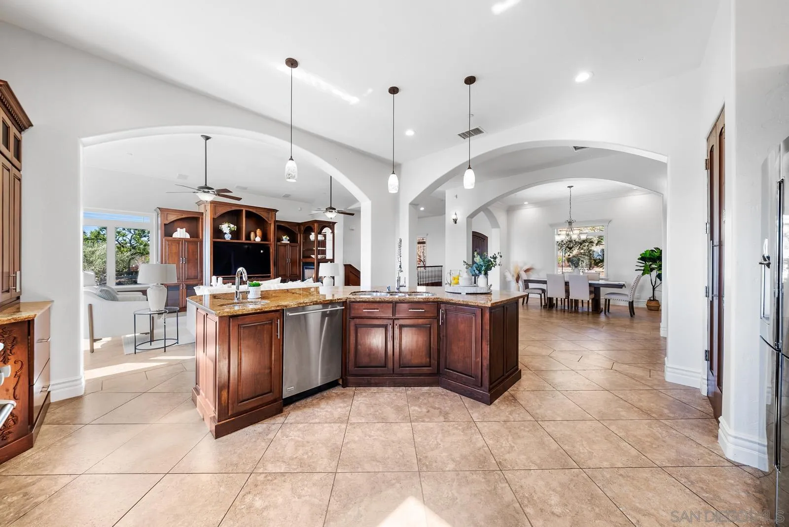 13170 Rancho Heights Road Pala, CA 92059 - Photo 11 of 75 a large kitchen with a stove a kitchen island a sink a counter top space and living room view