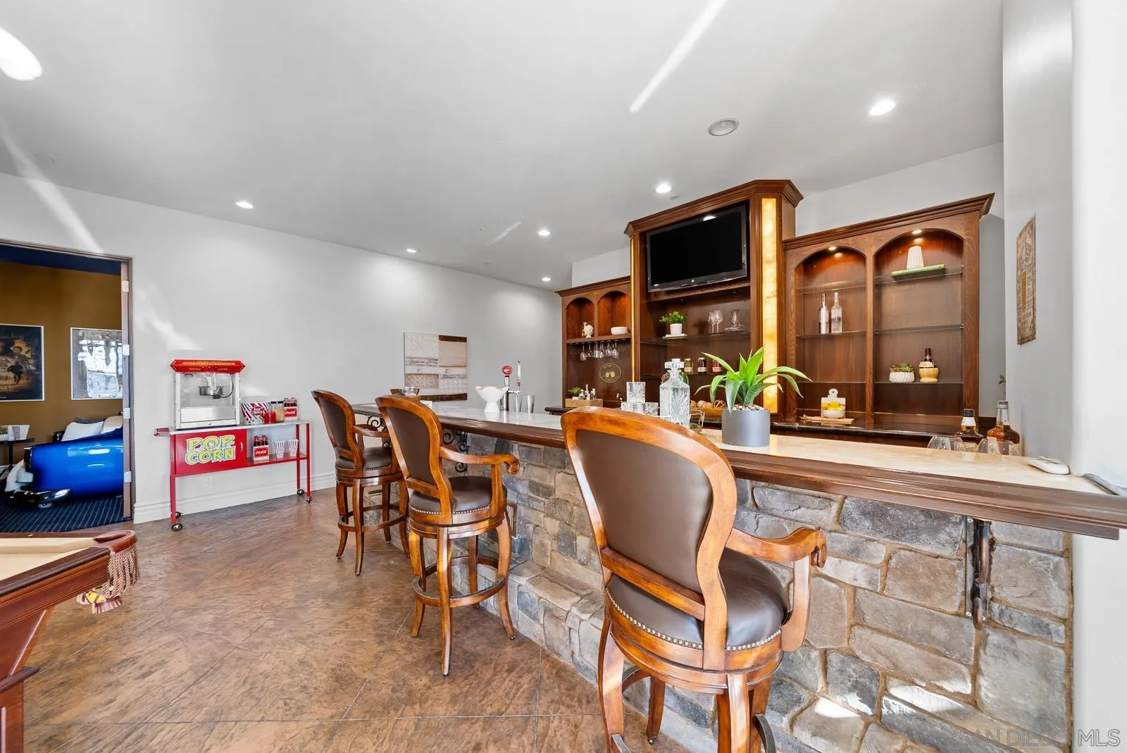 13170 Rancho Heights Road Pala, CA 92059 - Photo 31 of 75 a dining hall with stainless steel appliances a dining table and chairs with the front door