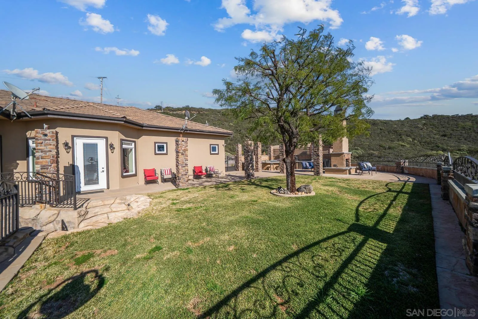 13170 Rancho Heights Road Pala, CA 92059 - Photo 49 of 75 a view of a house with backyard and sitting area