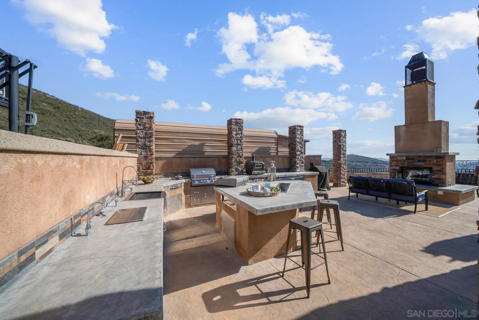 13170 Rancho Heights Road Pala, CA 92059 - Photo 51 of 75 a view of a terrace with furniture and city view