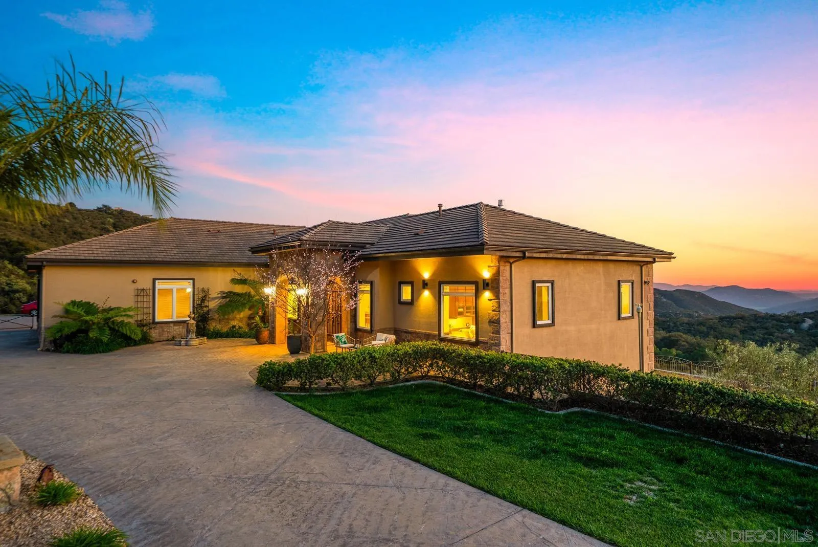 13170 Rancho Heights Road Pala, CA 92059 - Photo 64 of 75 a front view of a house with a yard and garage