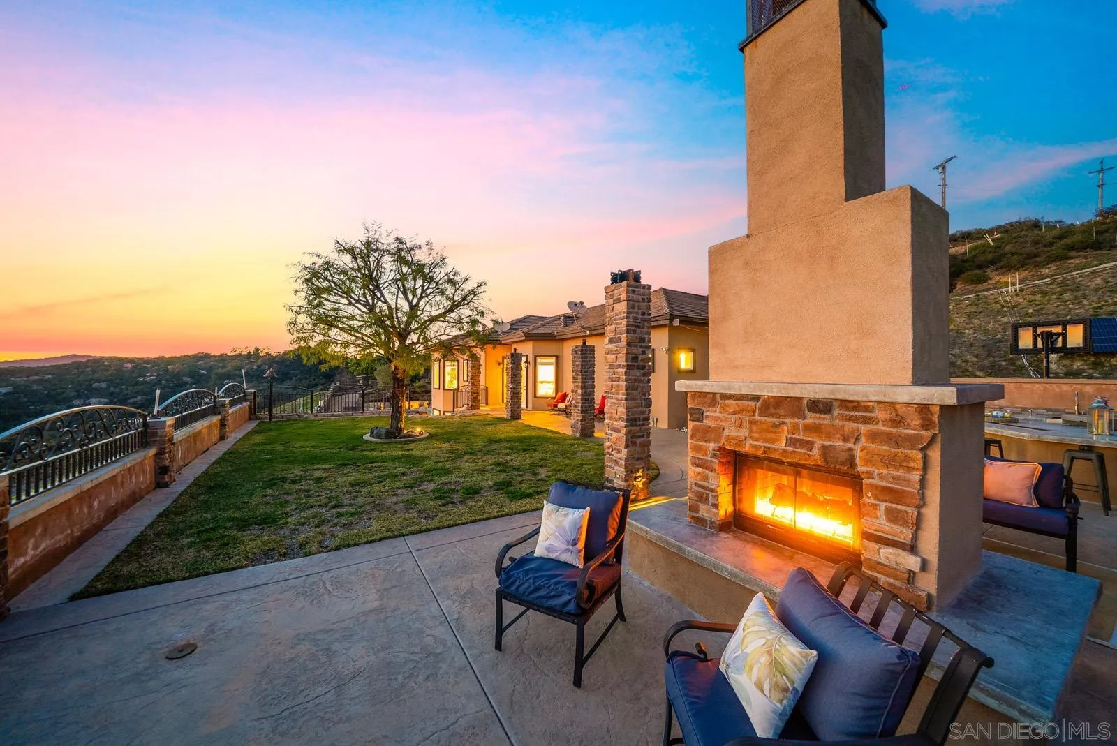 13170 Rancho Heights Road Pala, CA 92059 - Photo 67 of 75 a view of a patio with couches and table and chairs and potted plants