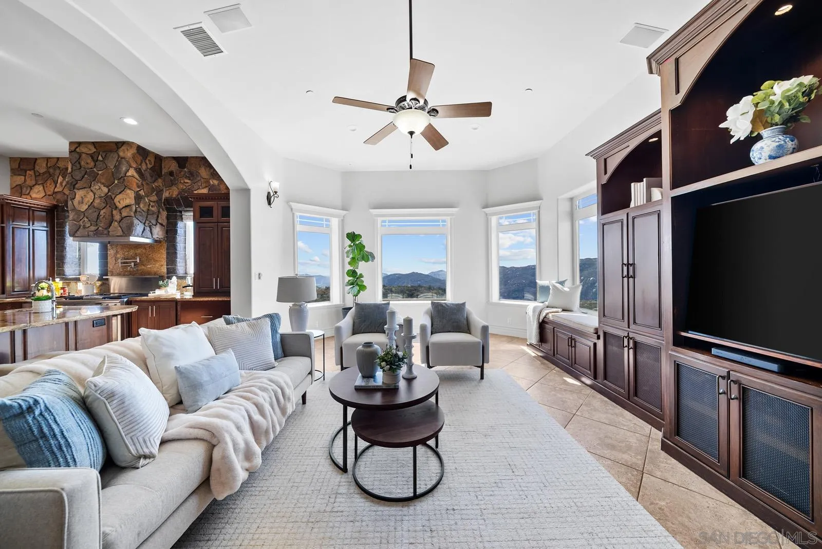 13170 Rancho Heights Road Pala, CA 92059 - Photo 7 of 75 a living room with furniture a flat screen tv and a chandelier