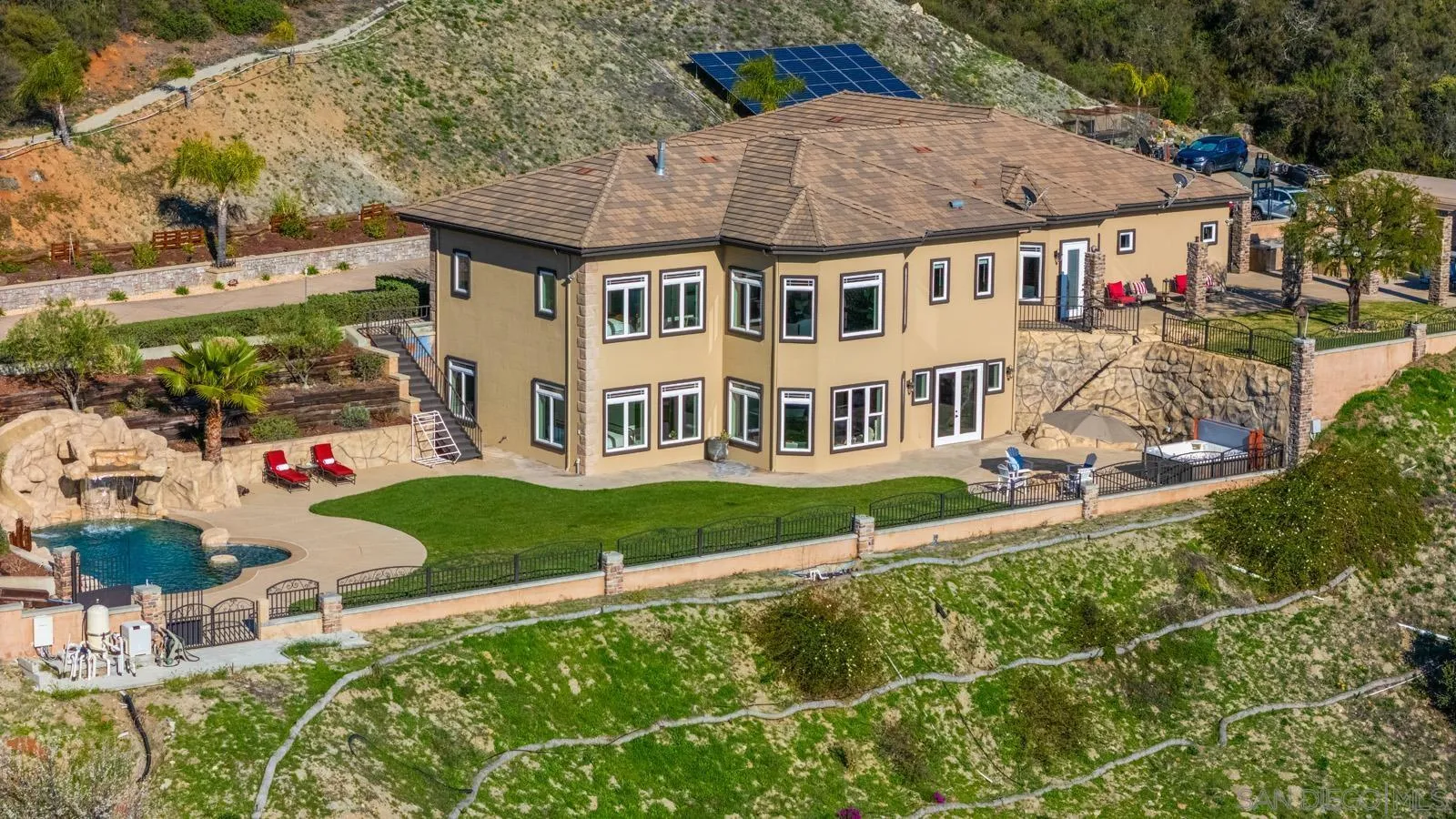 13170 Rancho Heights Road Pala, CA 92059 - Photo 75 of 75 a front view of a house with a yard table and chairs
