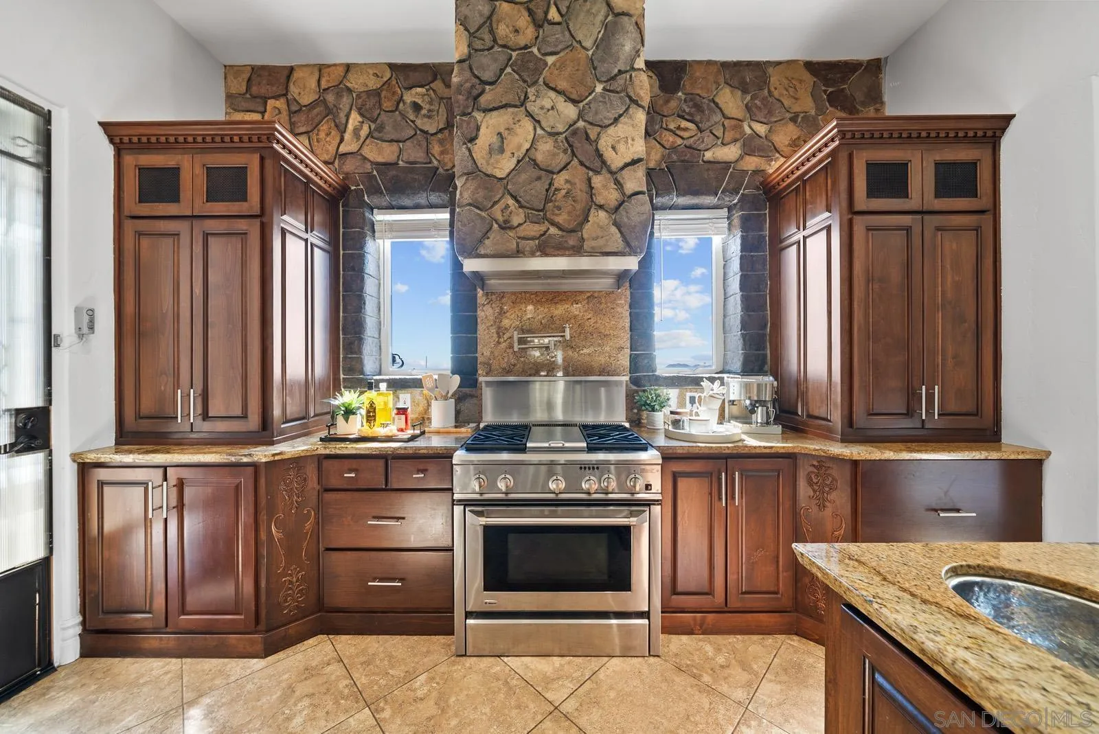 13170 Rancho Heights Road Pala, CA 92059 - Photo 10 of 75 a kitchen with stainless steel appliances granite countertop a stove and cabinets
