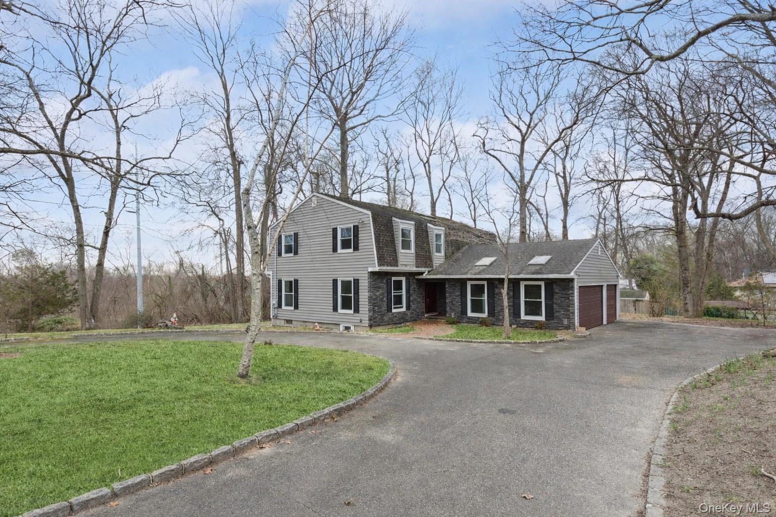 49 Overhill Road Wading River, NY 11792 - Photo 1 of 27 front view of a house with a yard
