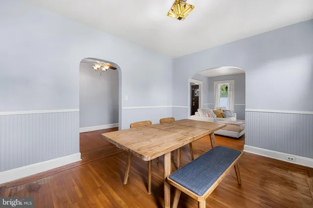 a dining room with a table and chairs