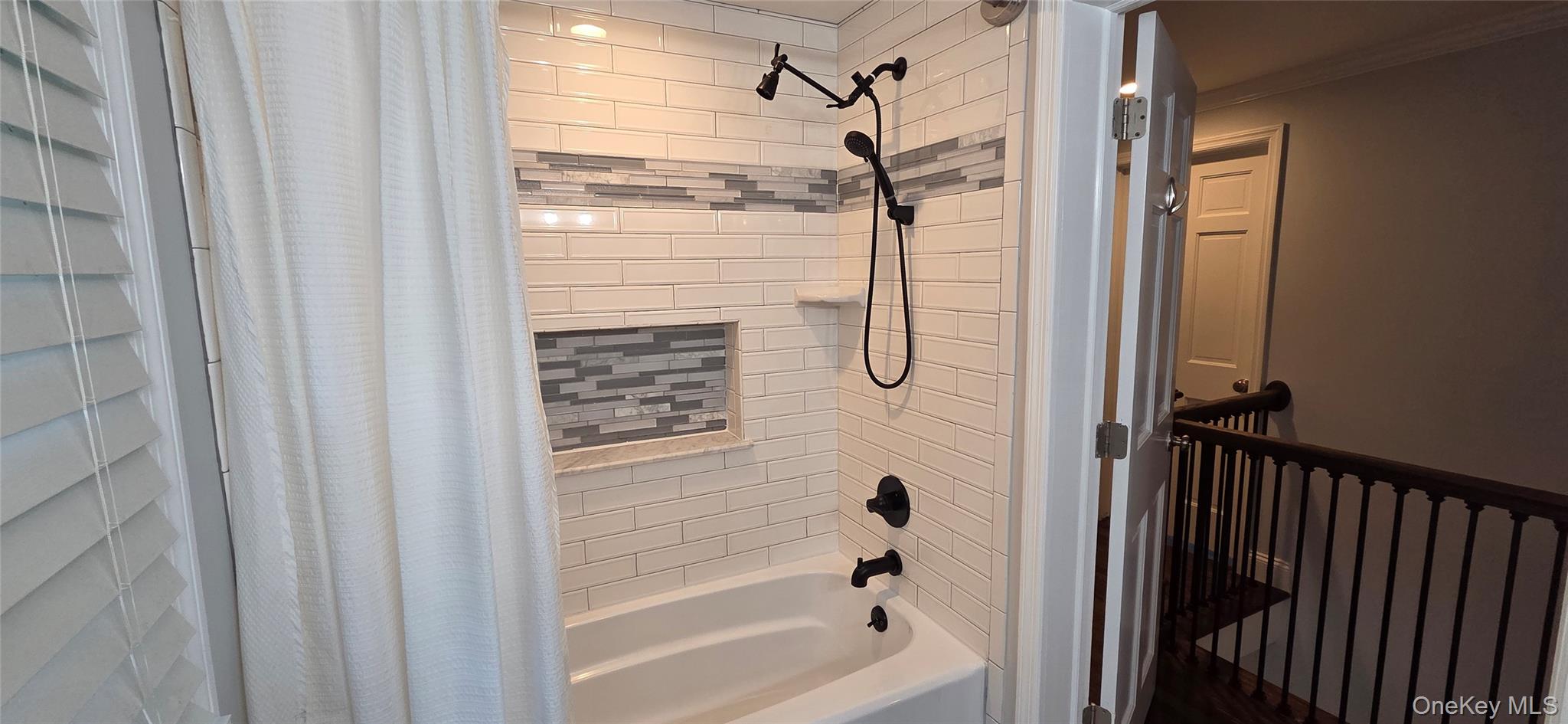 522 Moriches Road St. James, NY 11780 - Photo 36 of 49 a bathroom with a glass shower door and a window
