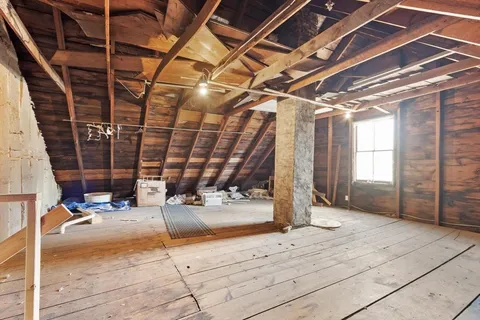 a view of a garage with wooden floor