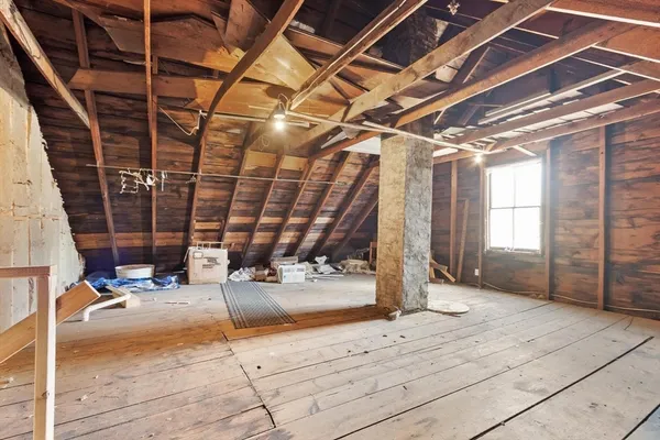 a view of a garage with wooden floor